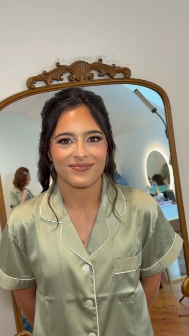 Bride in soft glam wedding makeup at her getting-ready mirror — DS Artistry Baltimore