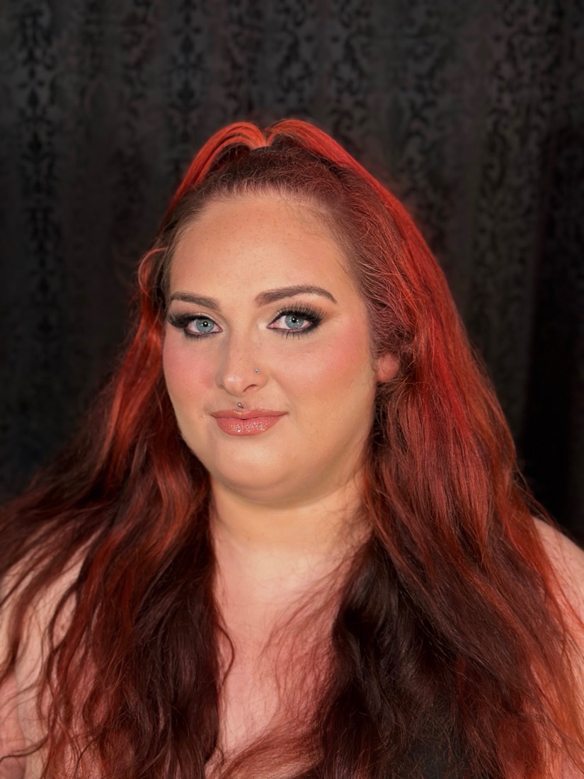 Bold glam makeup look on a red-haired client